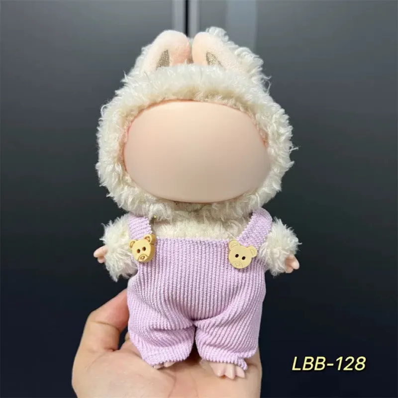 Plastic clothing costume for a 17cm tall vinyl doll figurine on display.