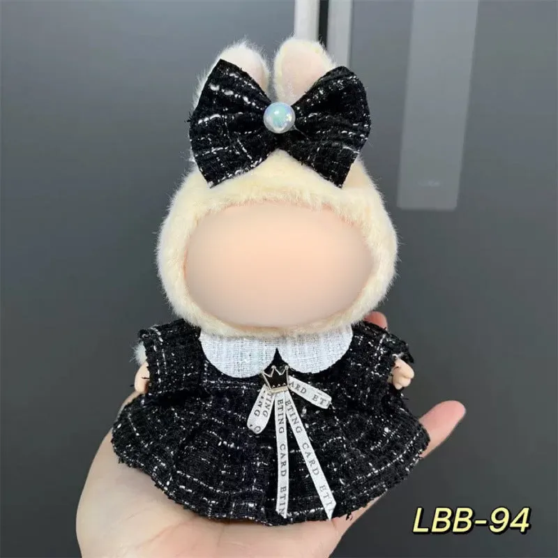 Plastic clothing costume for a 17cm tall vinyl doll figurine on display.