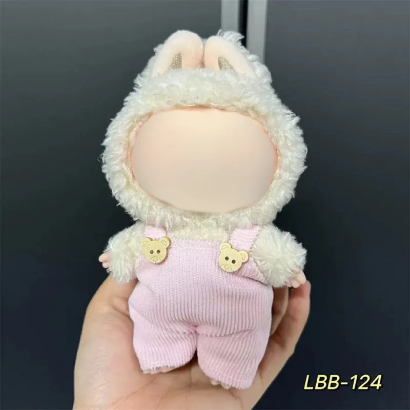 Plastic clothing costume for a 17cm tall vinyl doll figurine on display.