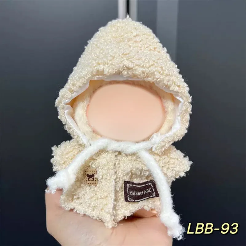 Plastic clothing costume for a 17cm tall vinyl doll figurine on display.