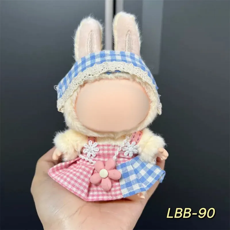 Plastic clothing costume for a 17cm tall vinyl doll figurine on display.