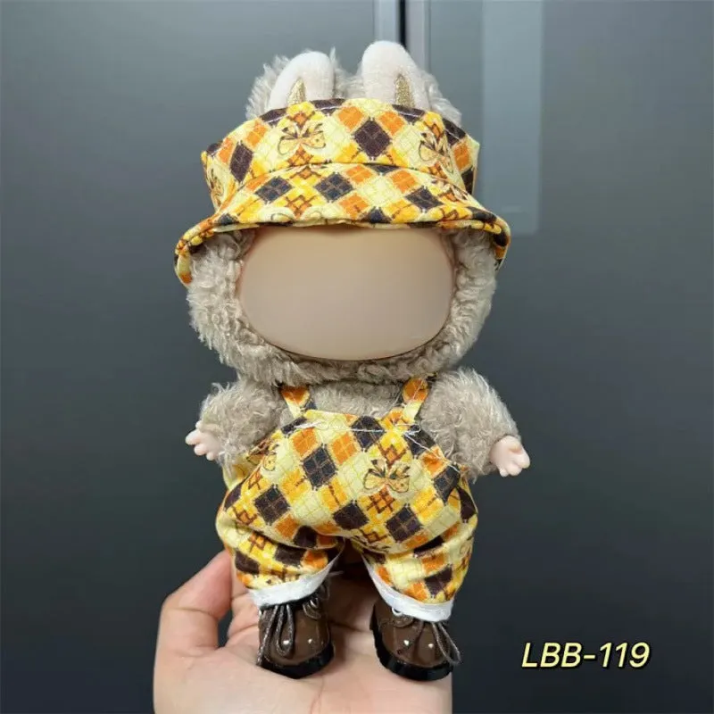 Plastic clothing costume for a 17cm tall vinyl doll figurine on display.