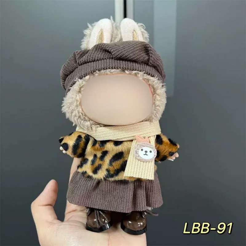 Plastic clothing costume for a 17cm tall vinyl doll figurine on display.