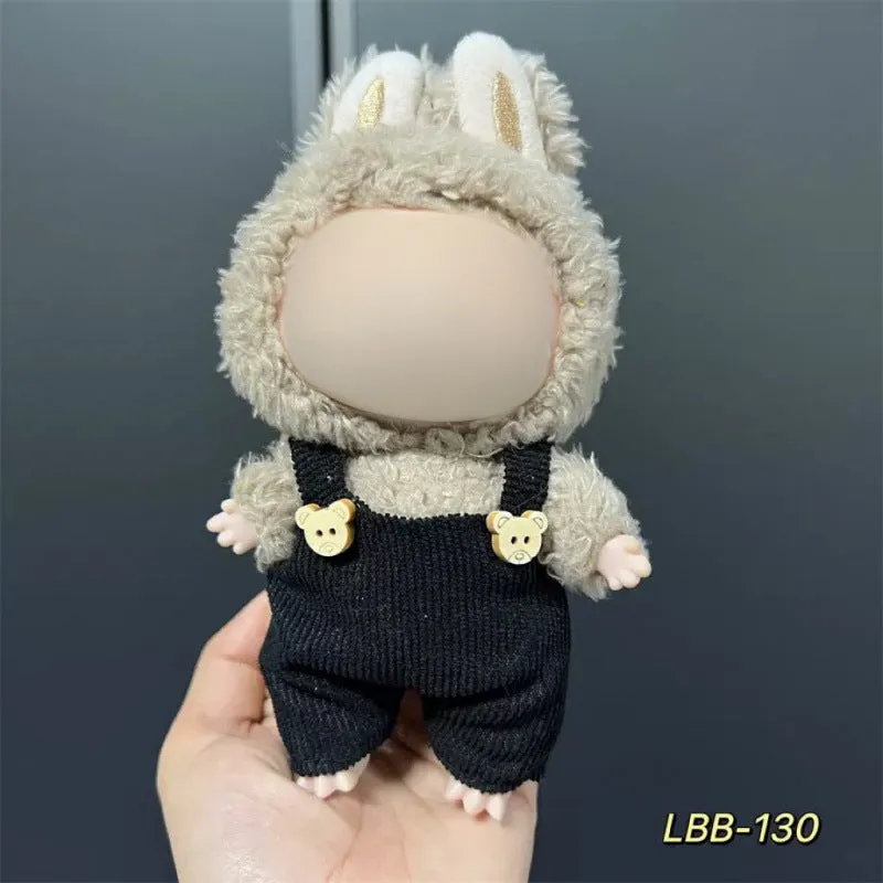 Plastic clothing costume for a 17cm tall vinyl doll figurine on display.