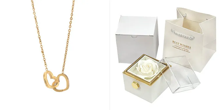 Rotating jewellery gift box with a preserved red rose under a clear acrylic dome.