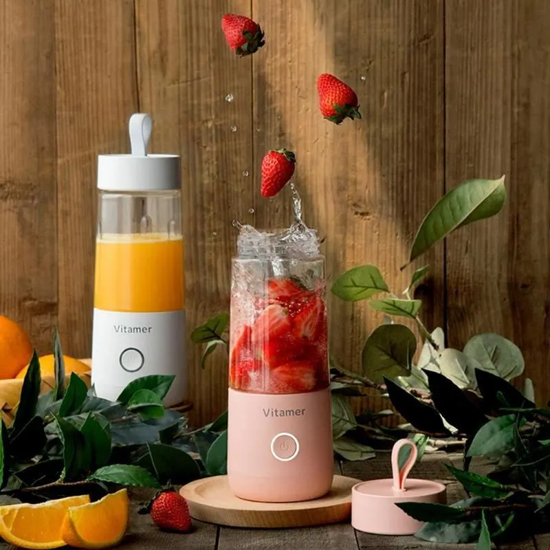 White portable USB blender with 350ml cup and silicone carry ring on a base.