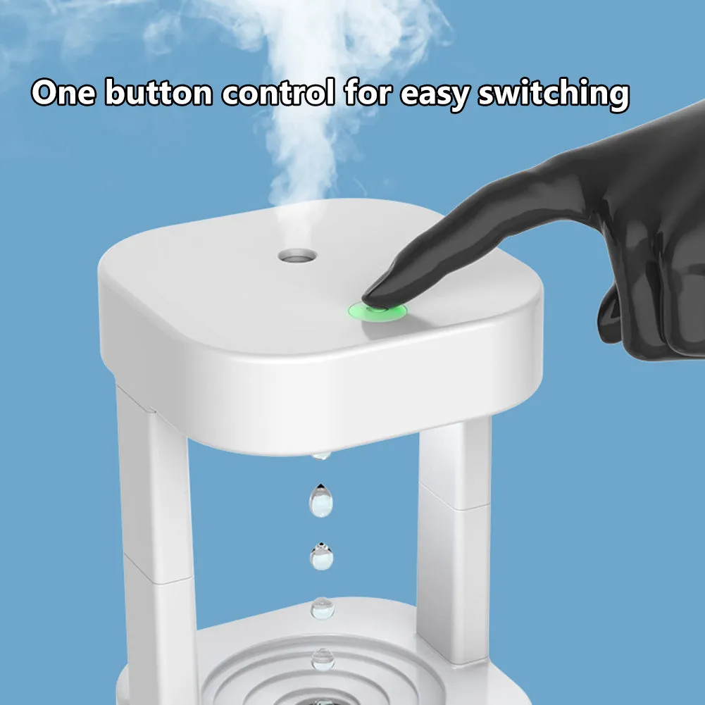 White anti-gravity water droplet USB humidifier with coloured lights on a desk