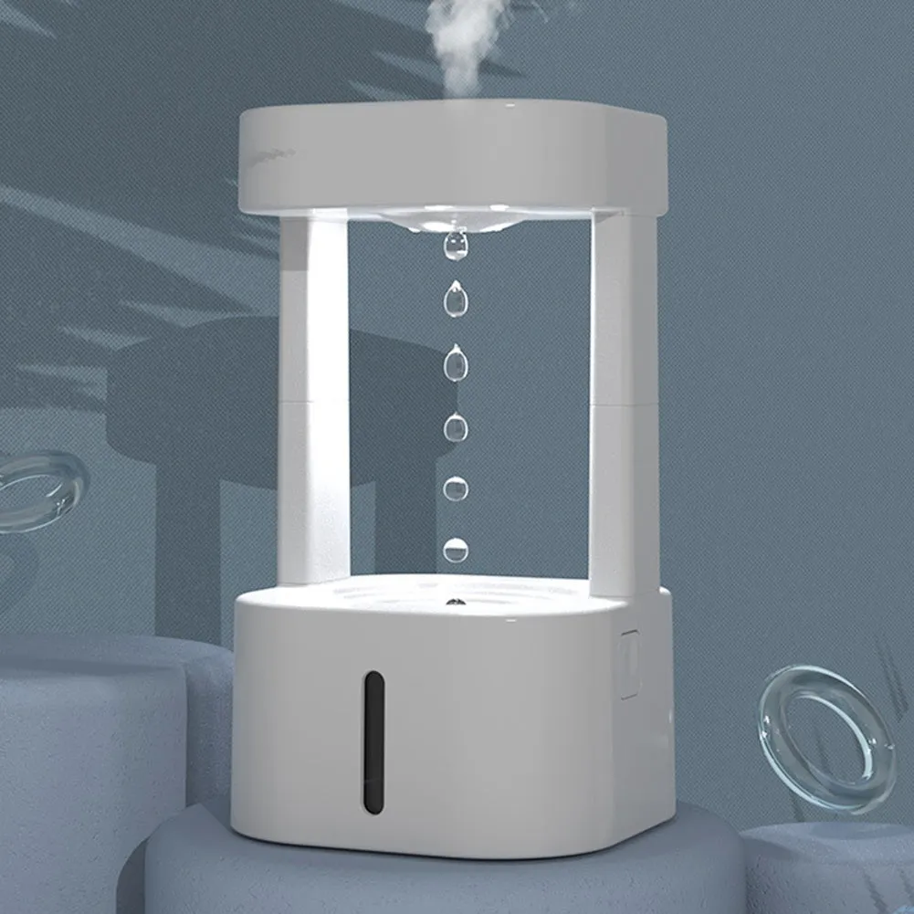 White anti-gravity water droplet USB humidifier with coloured lights on a desk