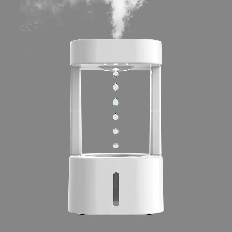 White anti-gravity water droplet USB humidifier with coloured lights on a desk
