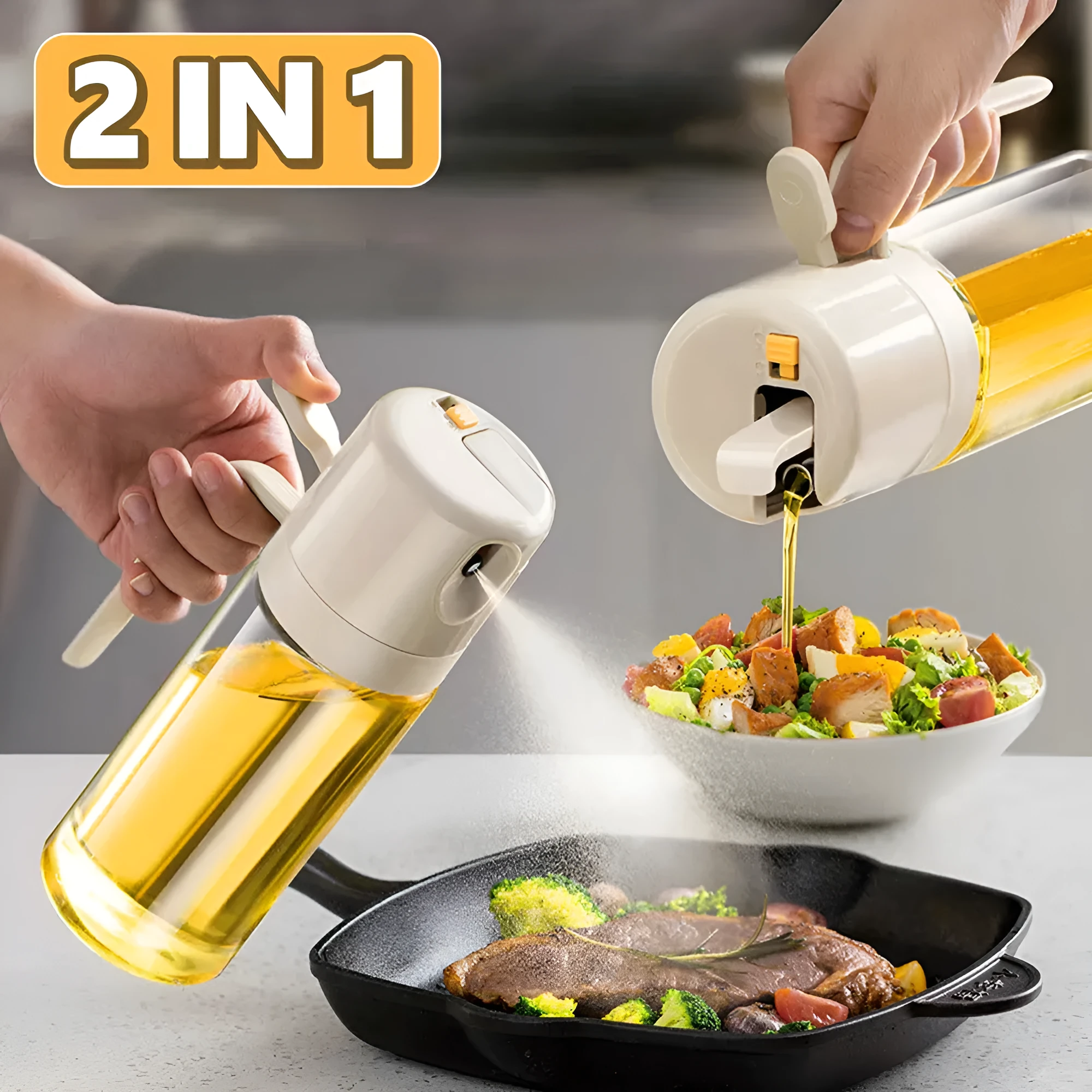 Warm grey glass 550ml oil sprayer bottle with a black spray head on a kitchen counter.
