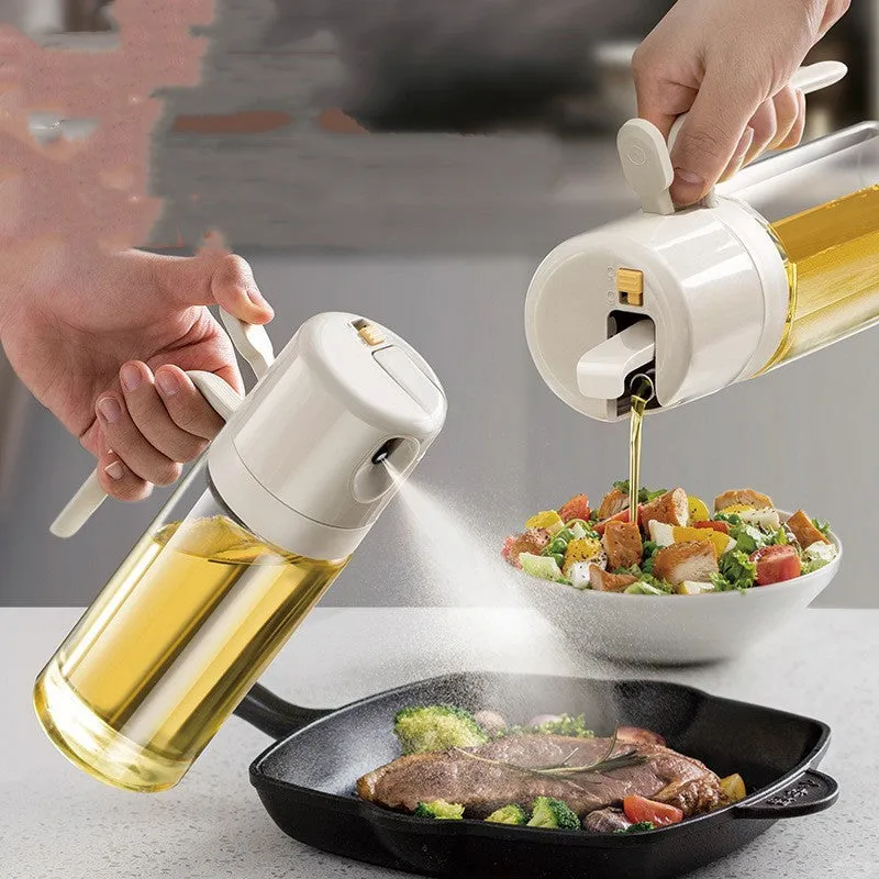 Warm grey glass 550ml oil sprayer bottle with a black spray head on a kitchen counter.