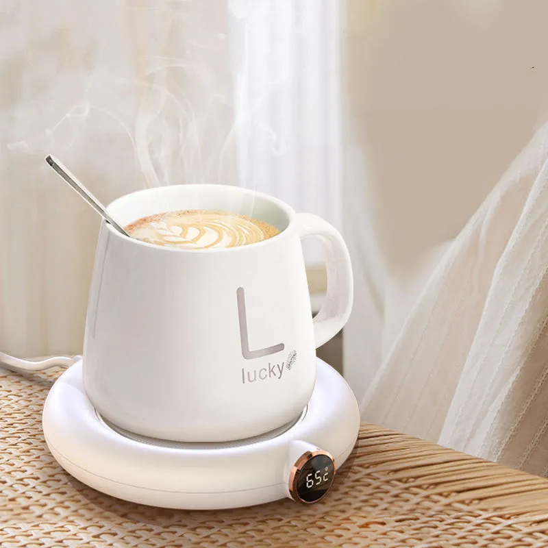 White USB-powered coffee mug warmer coaster on a wooden desk