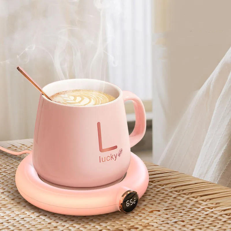 White USB-powered coffee mug warmer coaster on a wooden desk
