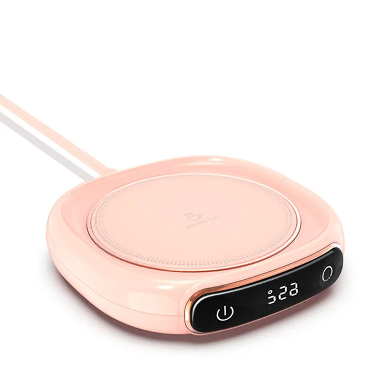 White USB-powered coffee mug warmer coaster on a wooden desk