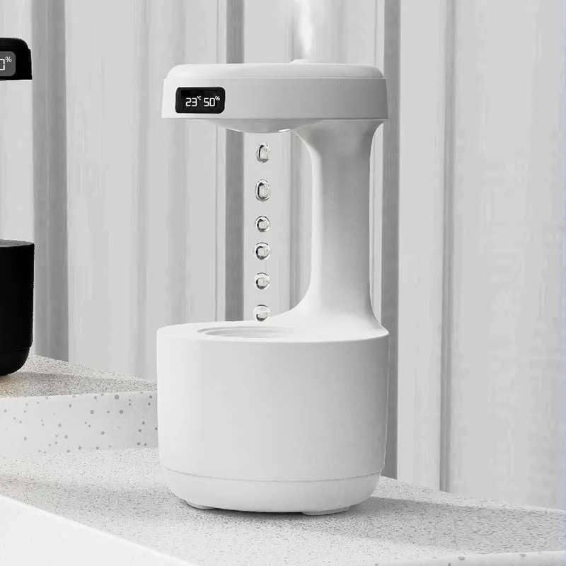 White columnar anti-gravity humidifier with LED clock display and water droplet backflow feature