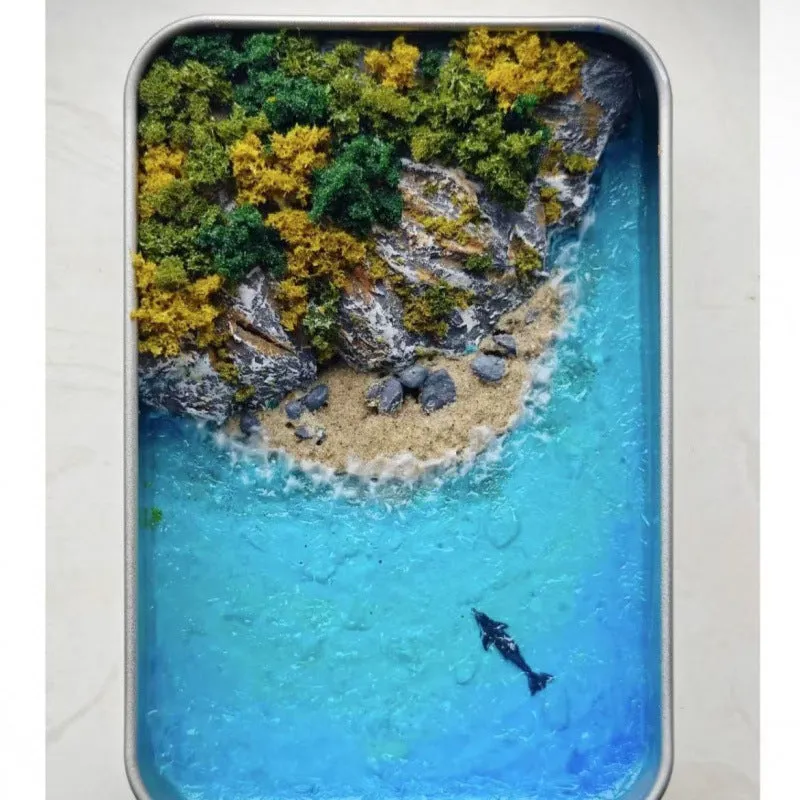 DIY bamboo handmade marine landscape model ornament for aquariums on a table.