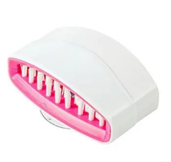 Blue kitchen cleaning brush with suction cup showing knife and fork design for washing fruits and vegetables