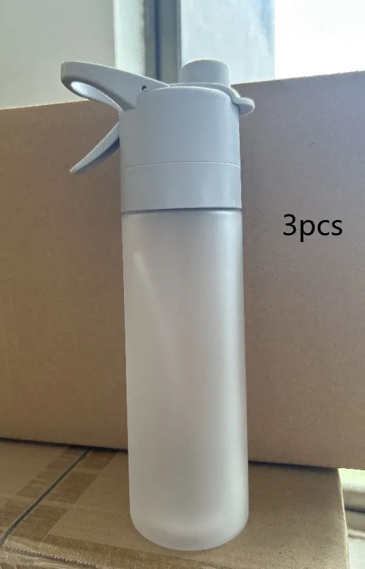 White 700ml plastic spray water bottle with handle strap and leakproof lid.