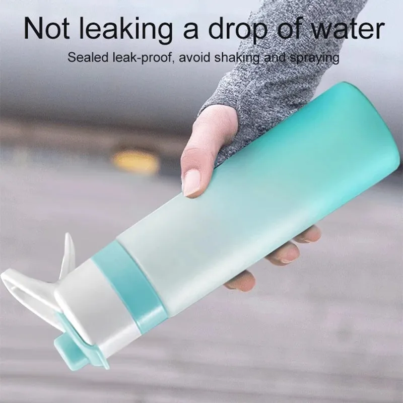 White 700ml plastic spray water bottle with handle strap and leakproof lid.