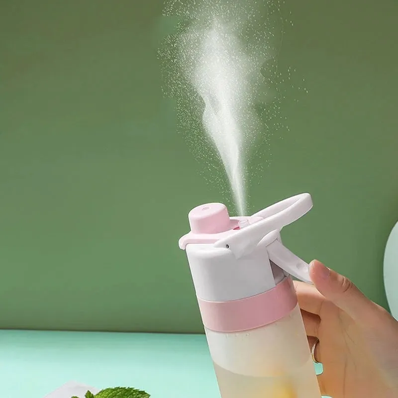 White 700ml plastic spray water bottle with handle strap and leakproof lid.