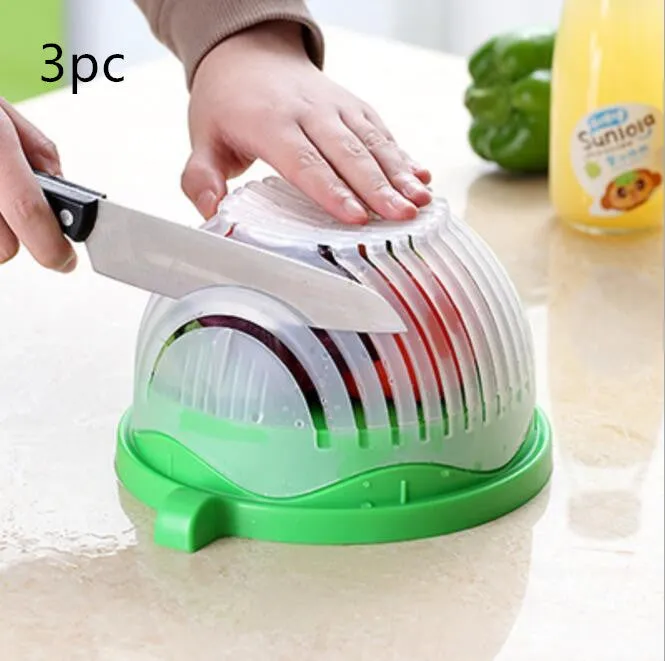 Blue salad cutter bowl with chopping lid and serving plate base on a kitchen counter