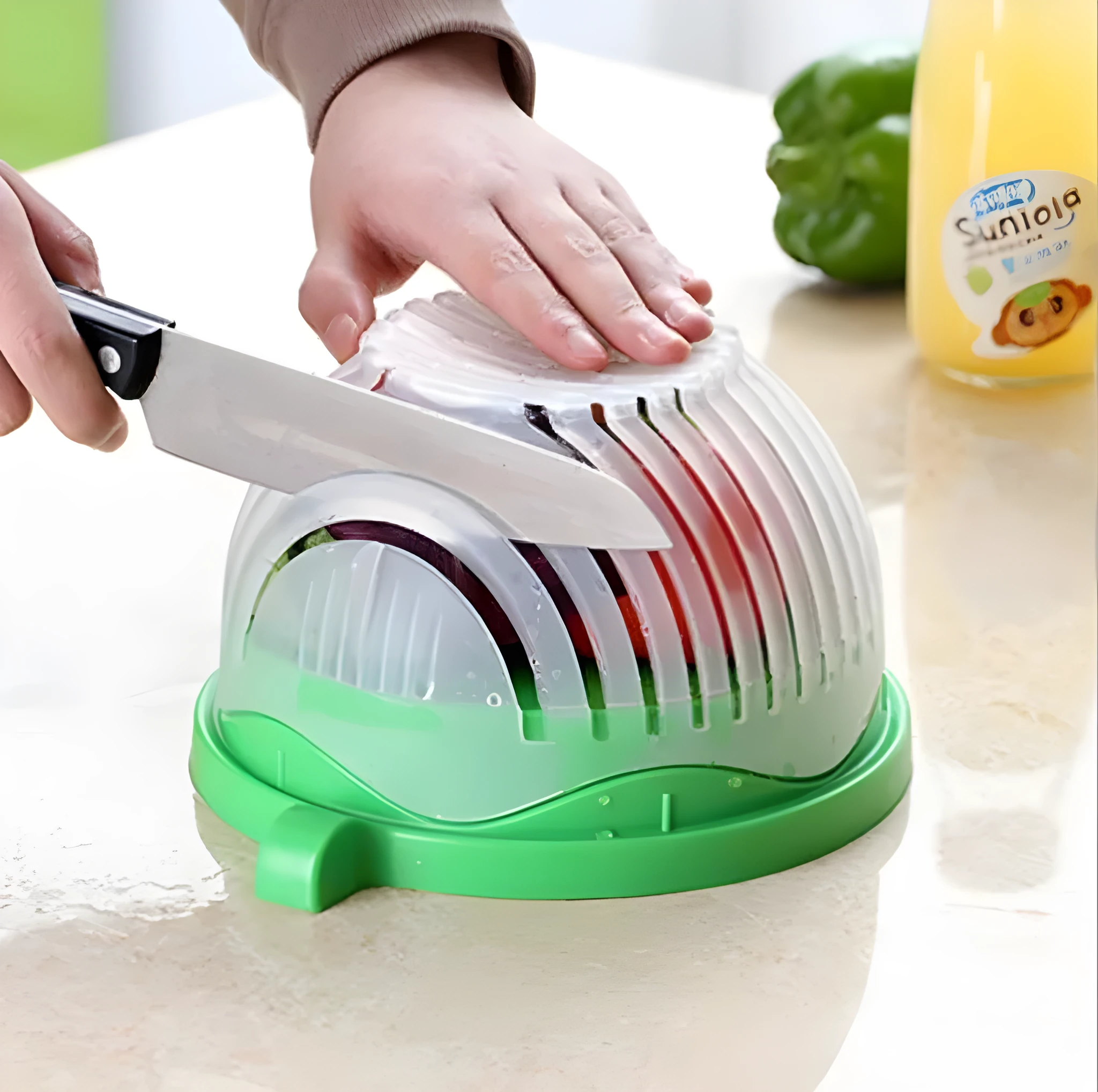 Blue salad cutter bowl with chopping lid and serving plate base on a kitchen counter