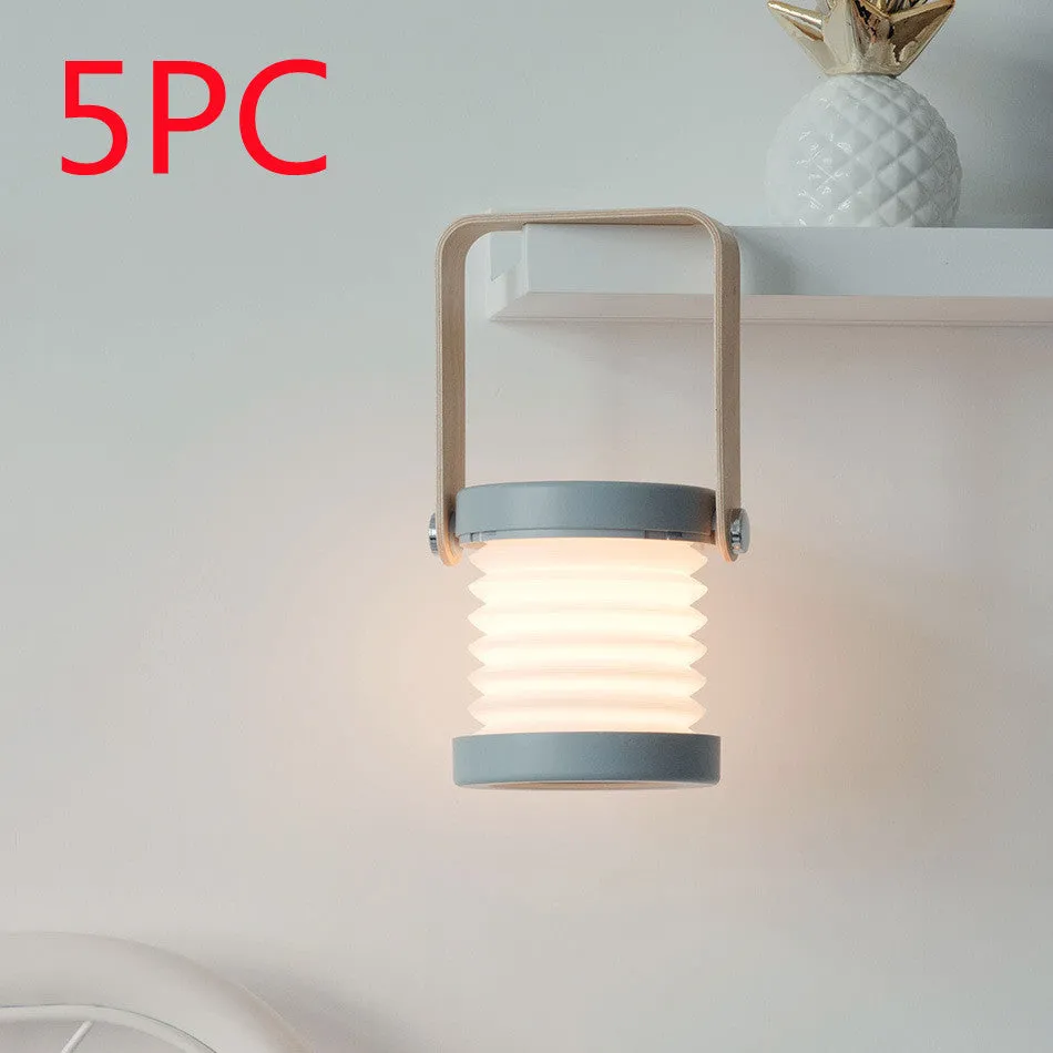 White foldable LED night light in both table lamp and tall lantern configurations, with USB cable.
