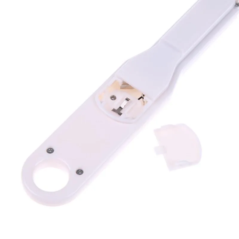 White digital spoon scale with LCD display showing weight measurement for kitchen use