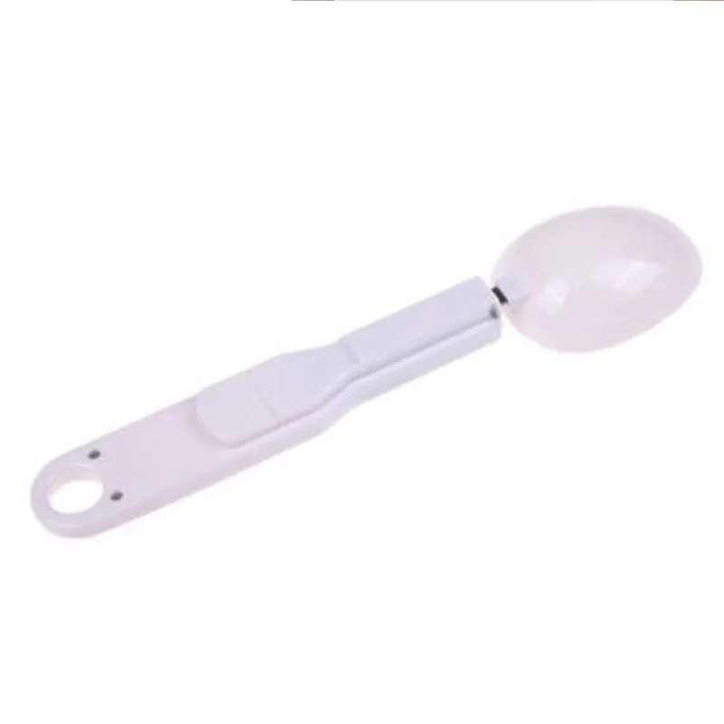 White digital spoon scale with LCD display showing weight measurement for kitchen use