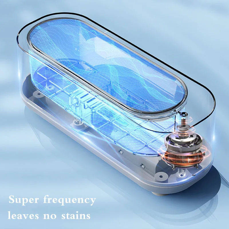 Off-white ultrasonic cleaning machine with stainless steel tank for jewellery and glasses.