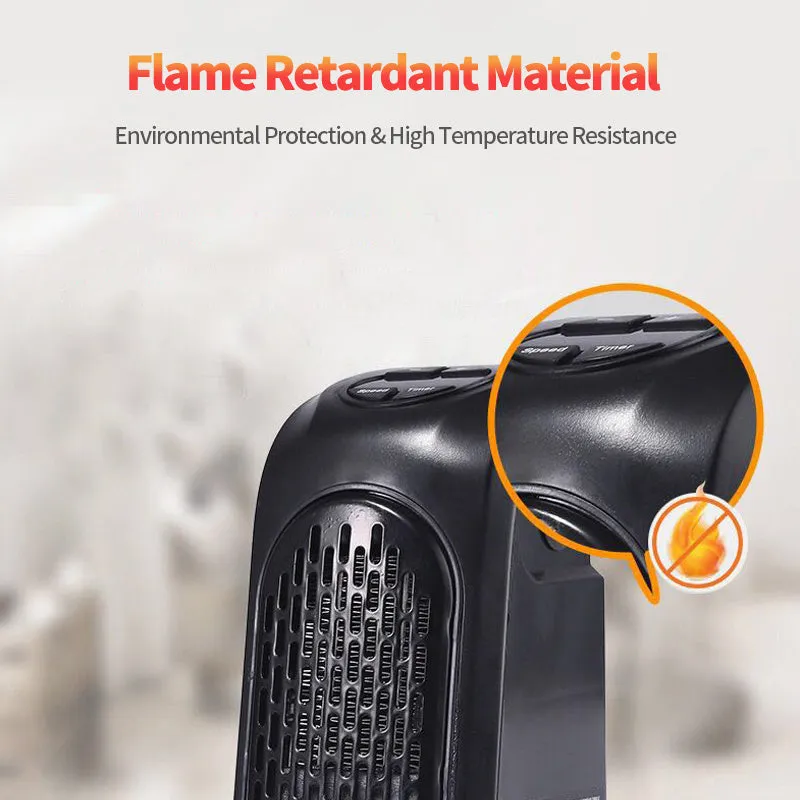 Small black ceramic fan heater with mechanical controls on a desk.