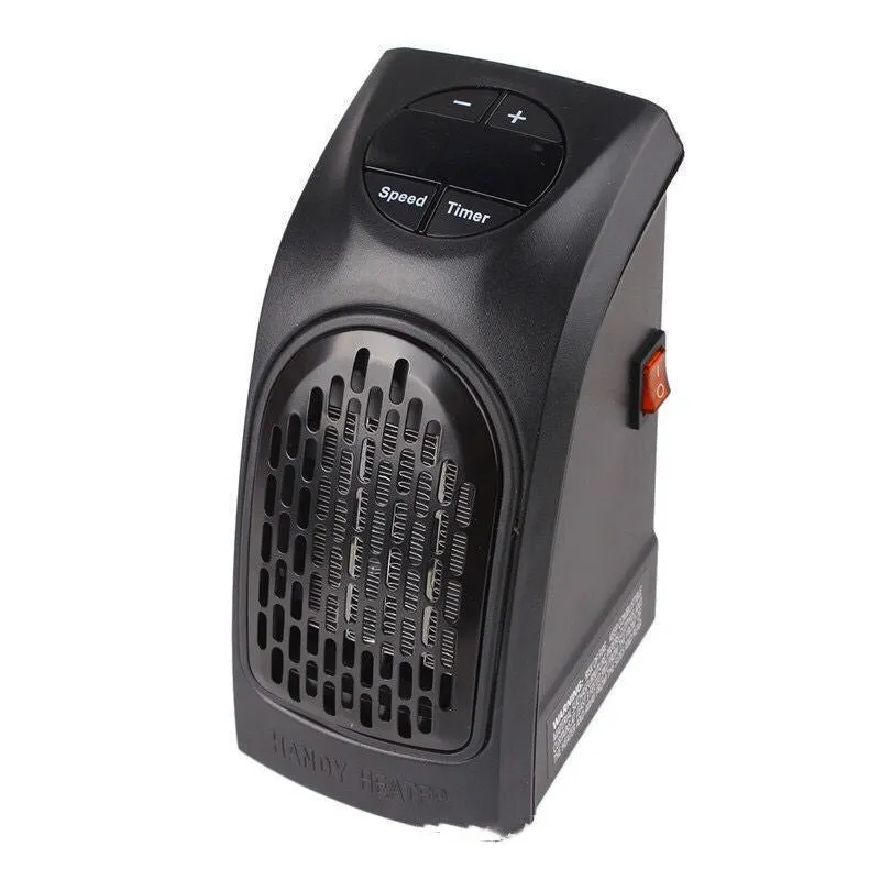 Small black ceramic fan heater with mechanical controls on a desk.