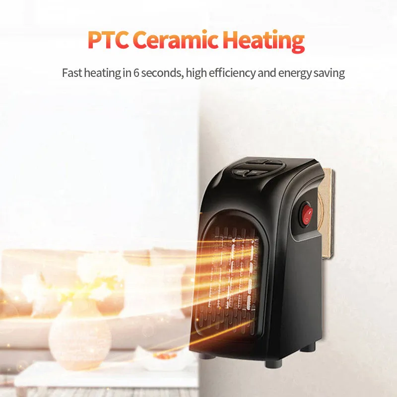 Small black ceramic fan heater with mechanical controls on a desk.