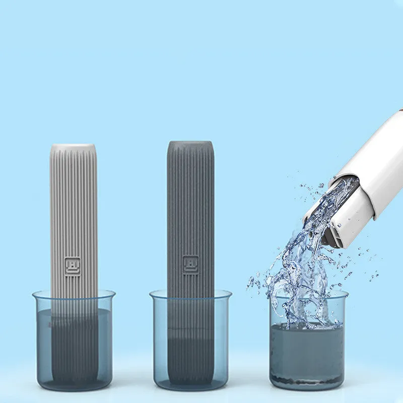 Mini plastic squeeze mop with a blue biodegradable cotton head and a push-pull dehydration ring on the handle.