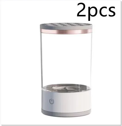 Grey and white portable electric makeup brush cleaner with USB cable.