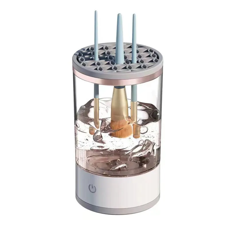 Grey and white portable electric makeup brush cleaner with USB cable.