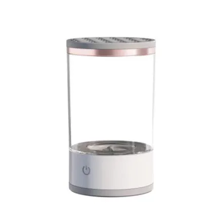 Grey and white portable electric makeup brush cleaner with USB cable.