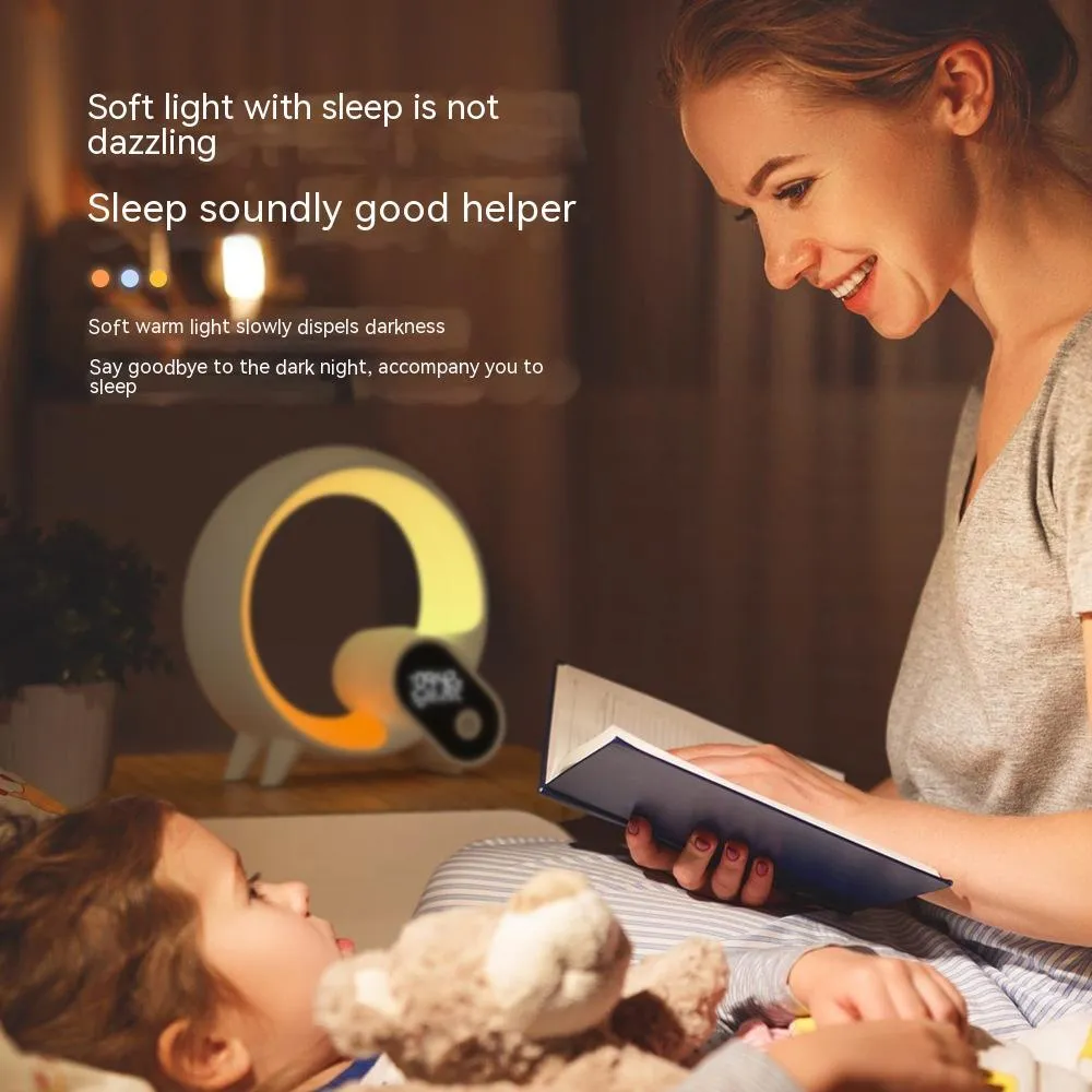 Creative Q modern digital alarm clock with colourful LED light ring in black or white finish.