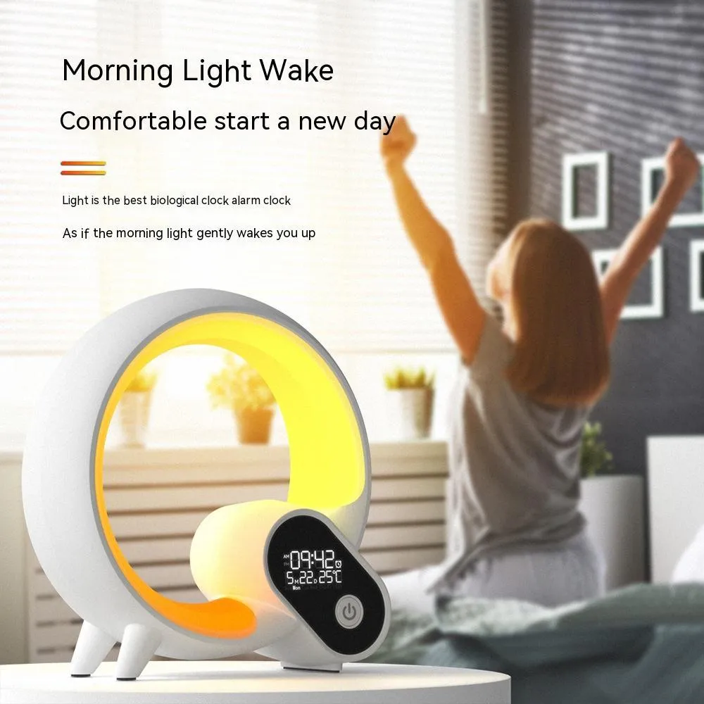 Creative Q modern digital alarm clock with colourful LED light ring in black or white finish.