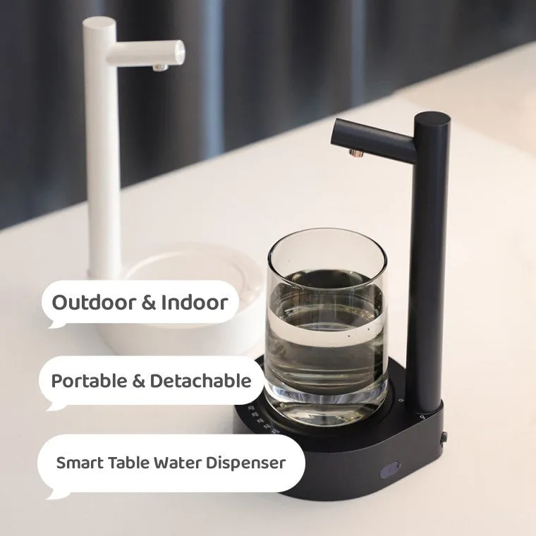 White electric water dispenser pump with USB cable next to water gallon bottle