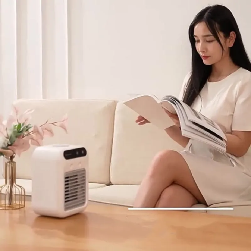 Compact ivory white portable USB air cooler with touchscreen display on a desk.
