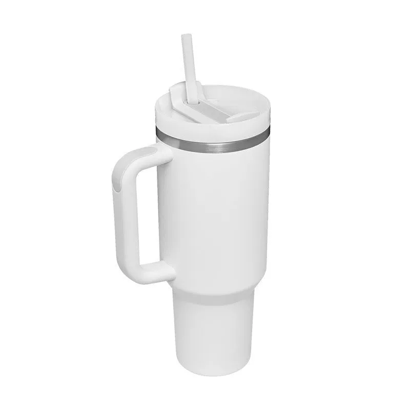 40 oz stainless steel insulated tumbler with a black handle, straw, and grey lid on a wooden table