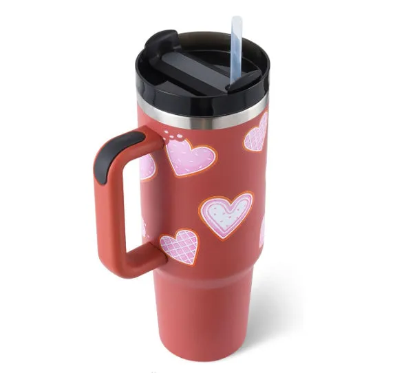 40 oz stainless steel insulated tumbler with a black handle, straw, and grey lid on a wooden table