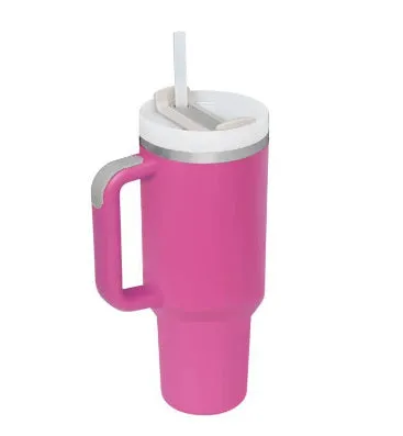 40 oz stainless steel insulated tumbler with a black handle, straw, and grey lid on a wooden table