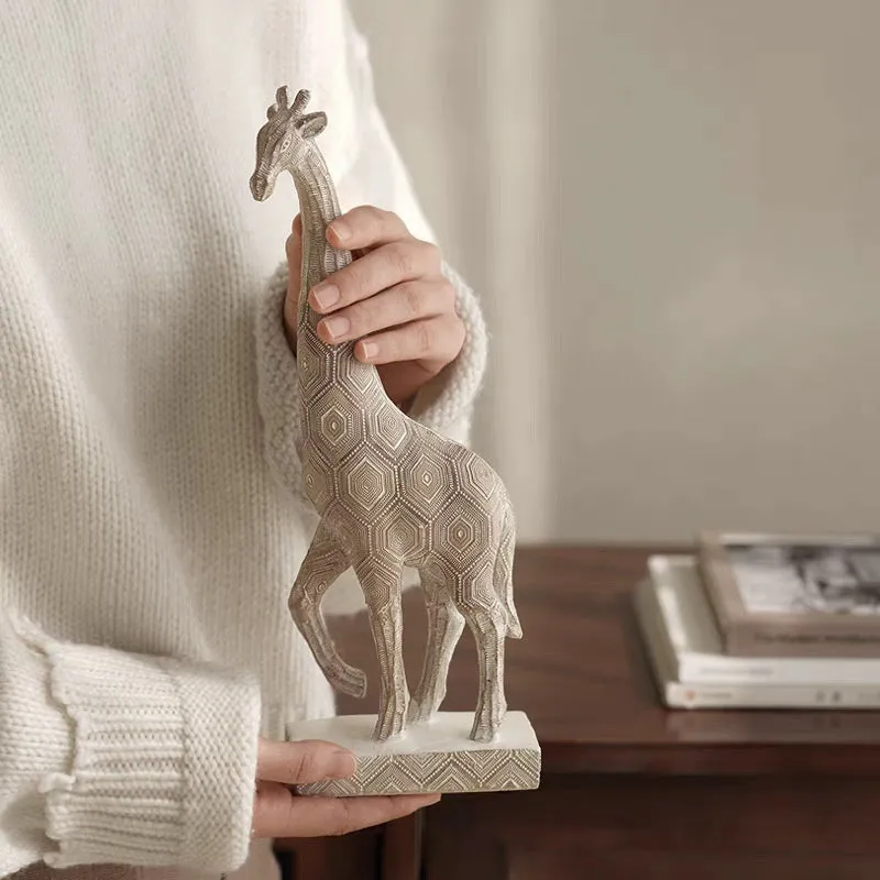 Wood colour European-style giraffe resin ornament on a shelf.