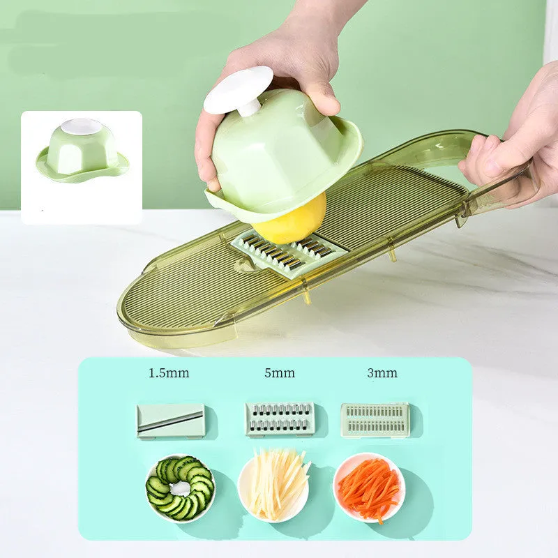 Transparent green vegetable cutter with stainless steel blades and 1.5L capacity container