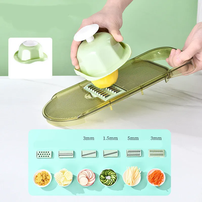 Transparent green vegetable cutter with stainless steel blades and 1.5L capacity container
