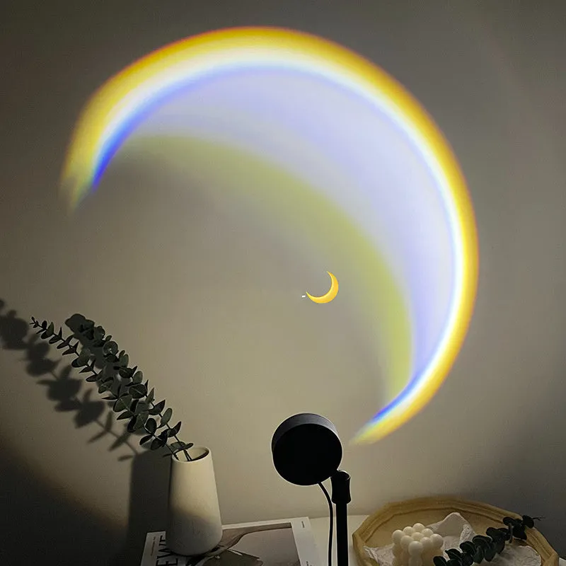 USB-powered moon projector lamp with Scandinavian design projecting rainbow pattern on wall