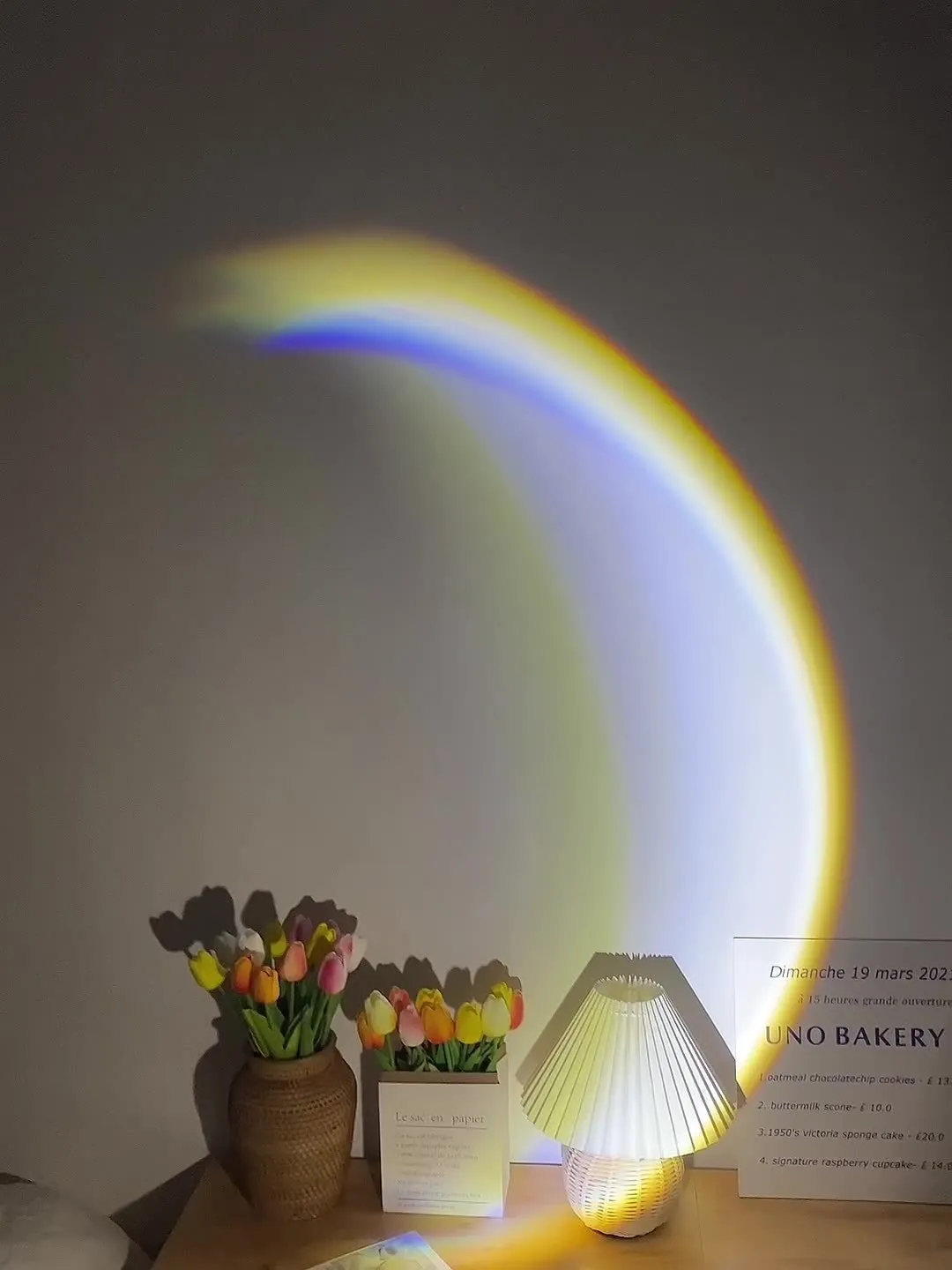 USB-powered moon projector lamp with Scandinavian design projecting rainbow pattern on wall