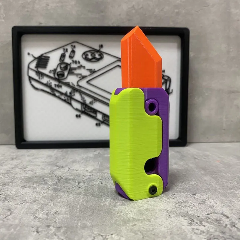 3D printed carrot gravity fidget knife in orange purple green colour, showing blade partly extended from sheath